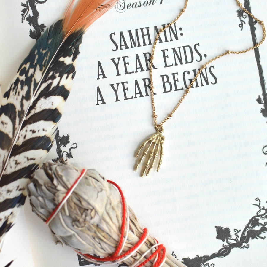 Grim Skeleton Hand Necklace
